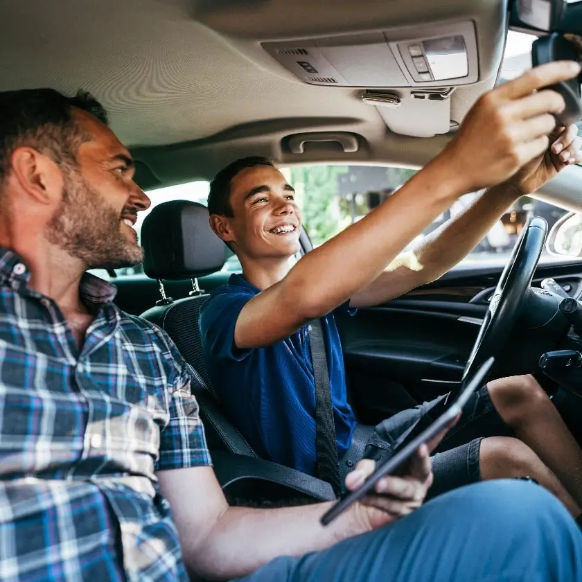 driving-instructor-sitting-his-student-and-explain-to-him-car-driving-basics-how-to-properly-prepare-himself-for-a-drive-view-from-inside-1-1